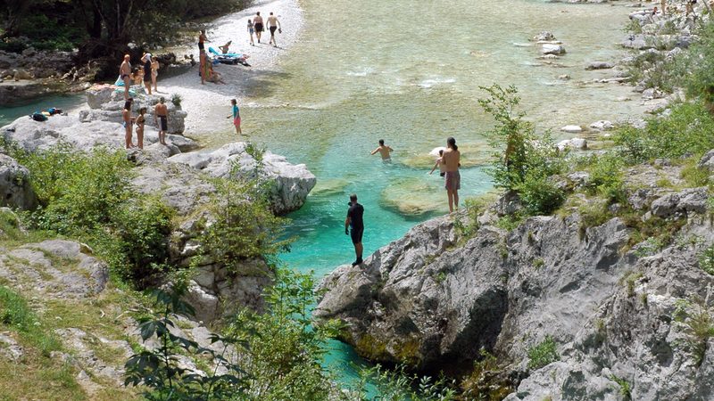 Bathing and sunbathing at Soča near Lepena